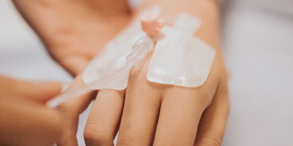 nurse-applying-iv-drip-patient (1)